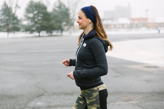 Side view woman running on training