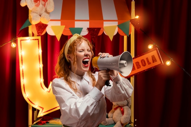 Free photo side view woman screaming with megaphone