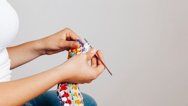 Side view of woman sewing