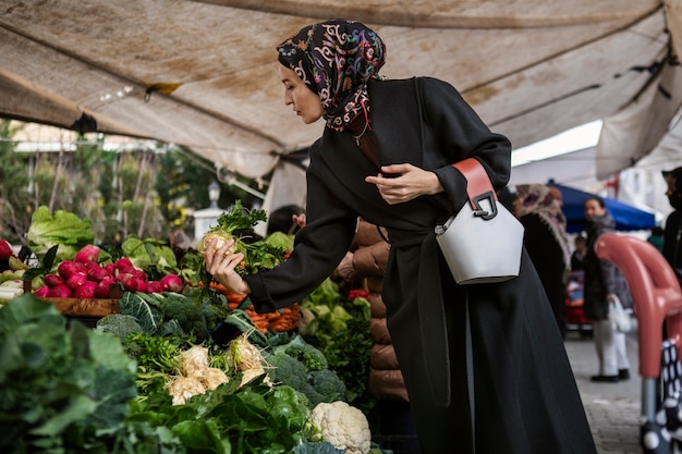 Side view woman shopping for ramadan