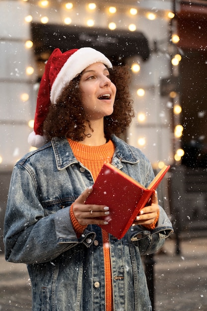 Side view woman singing christmas carol