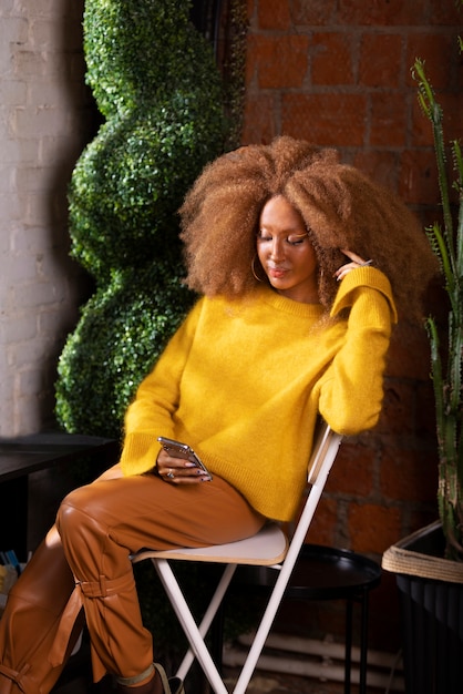 Side view woman sitting on chair