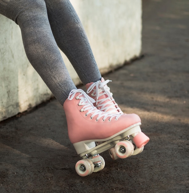 Side view of woman in socks with roller skates