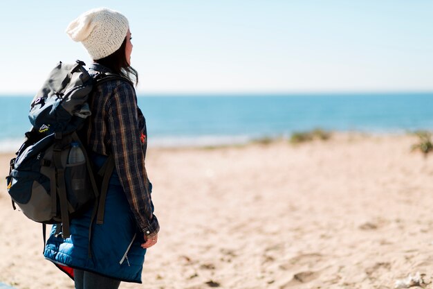 Side view woman standing on beach