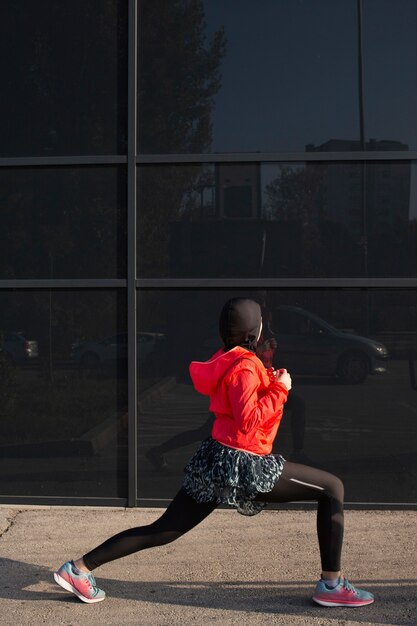 Side view of woman stretching