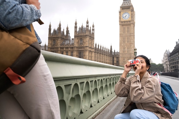 Side view woman taking photos