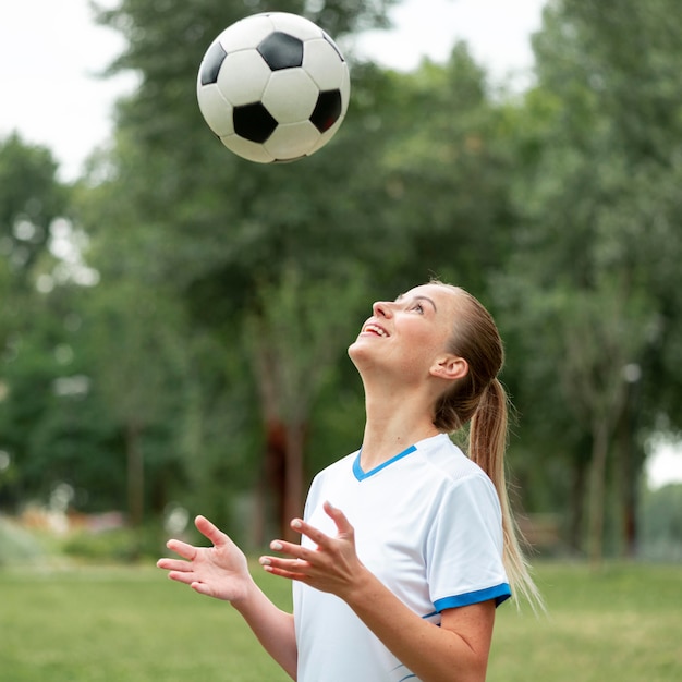 Side view woman throwing ball