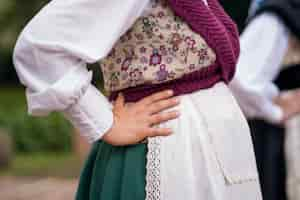 Free photo side view woman in traditional clothes