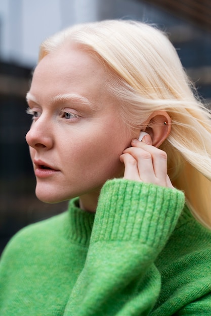 Side view woman wearing earphones