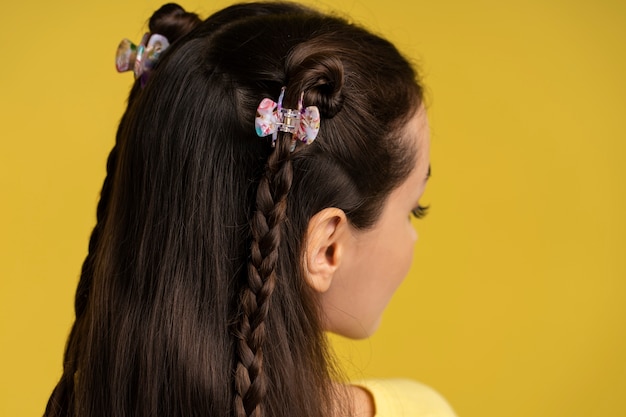 Free Photo side view woman wearing hair clips