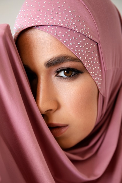 Side view woman wearing pink hijab