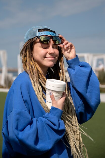 Side view woman with coffee cup