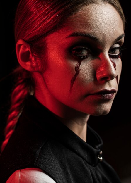 Side view of woman with fake blood make-up