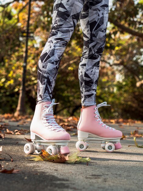 Side view of woman with roller skates and leggings