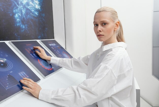 Side view woman working on digital monitors