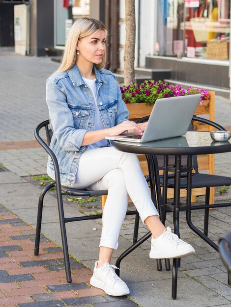 Side view of woman working outdoors