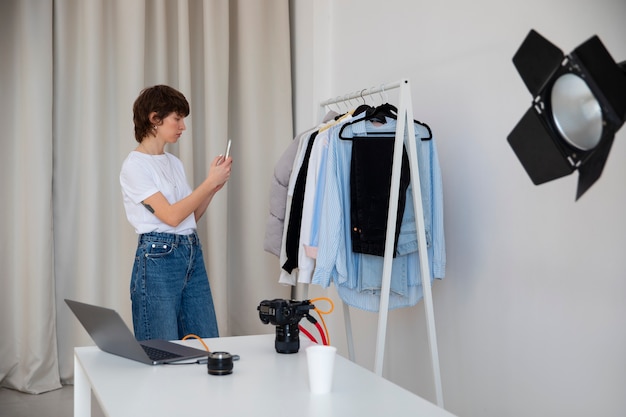 Side view woman working in photography studio