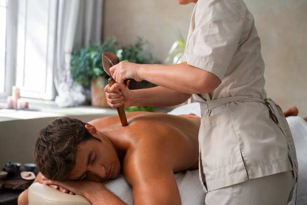 Side view woman working at a spa