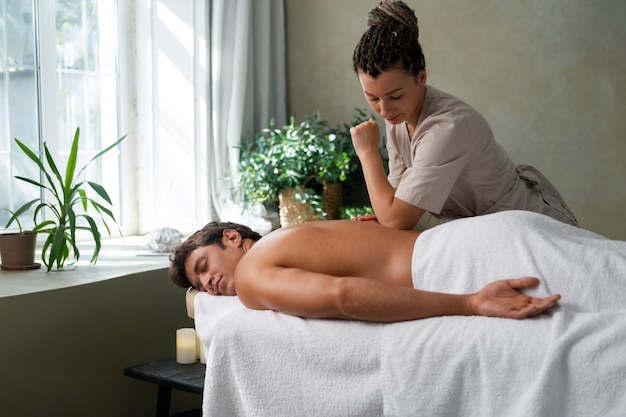 Side view woman working at a spa