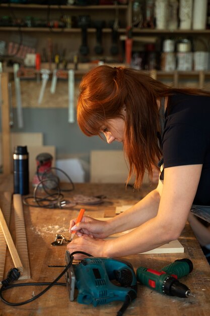 Side view woman working with tools