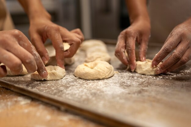 Side view women baking in kitchen