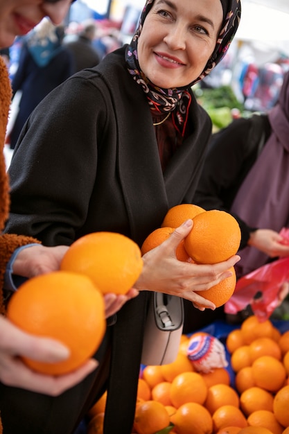 Side view women shopping for ramadan