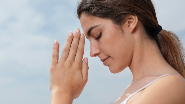 Side view young woman meditating