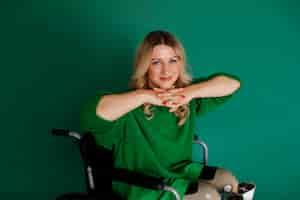 Free photo side view young woman in wheelchair