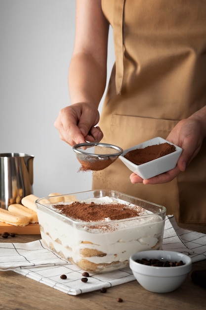 Sided view cook preparing tiramisu