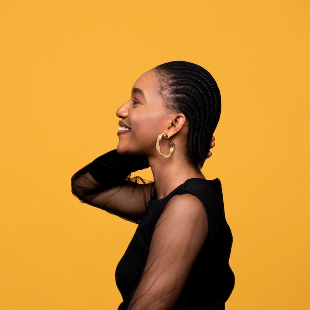 Sideways african woman with golden earrings