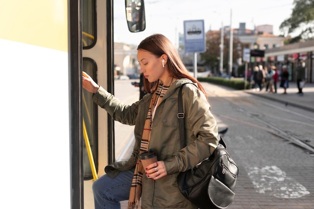 Free photo sideways passenger entering the tram