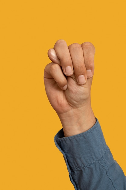 Sign language symbol isolated on yellow