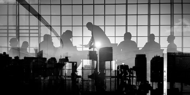 Free photo silhouette business people discussion meeting cityscape team concept