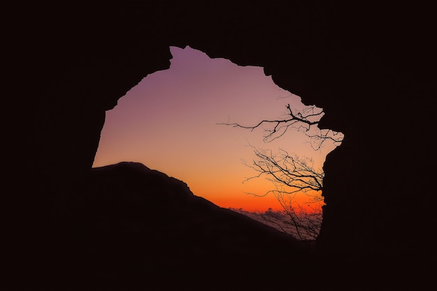 Free Photo silhouette of cave during sunset