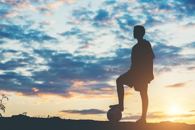 Free photo silhouette of children play soccer football