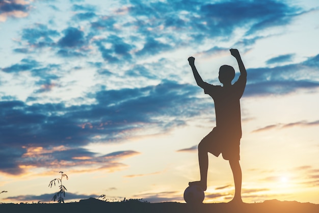 Free Photo silhouette of children play soccer football