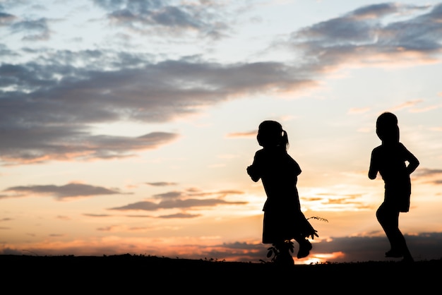 Silhouette of children playing 