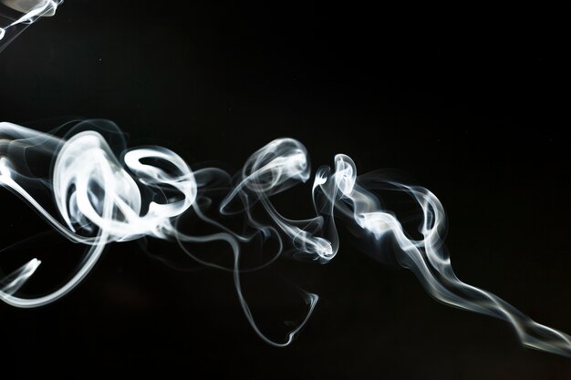 Silhouette of delicate white smoke