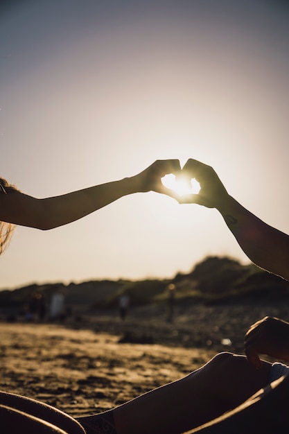 Silhouette of hands forming heart