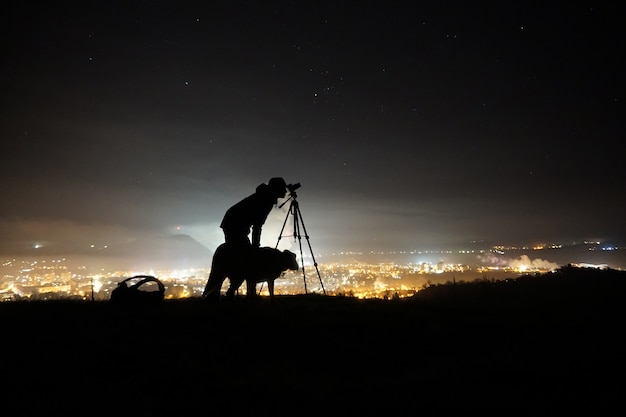 Free Photo silhouette of a man a dog