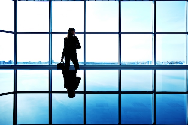 Silhouette of a pensive businesswoman