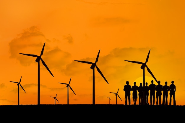 Silhouette of people enjoying the renewable energy