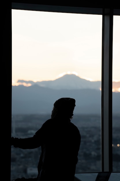 Free photo silhouette of person in the city