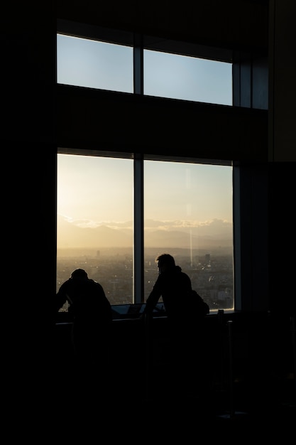 Free Photo silhouette of person in the city