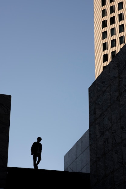 Free Photo silhouette of person in the city