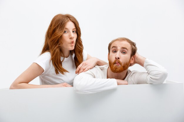 Silly redhead couple making funny faces