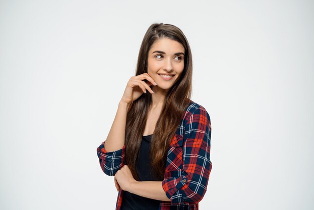 Silly smiling woman looking aside happy