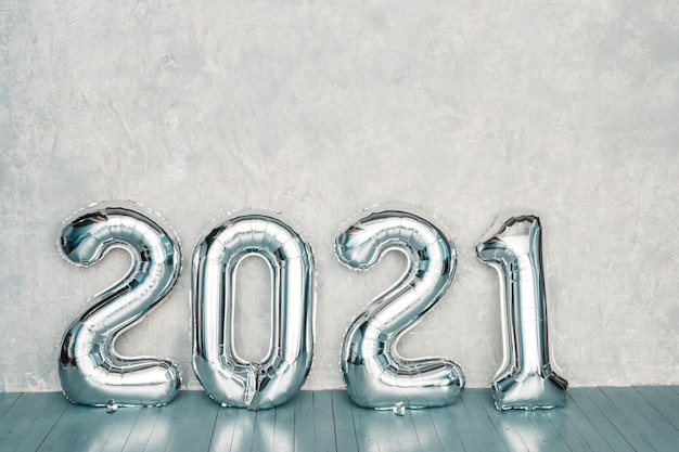 Free photo silver 2021 balloons. happy new 2021 year. metallic numbers 2021