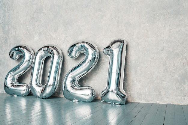 Free photo silver 2021 balloons. happy new 2021 year. metallic numbers 2021