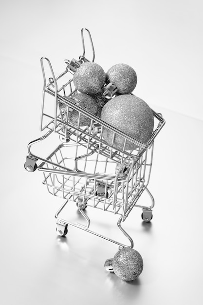 Free Photo silver aesthetic wallpaper with shopping cart high angle